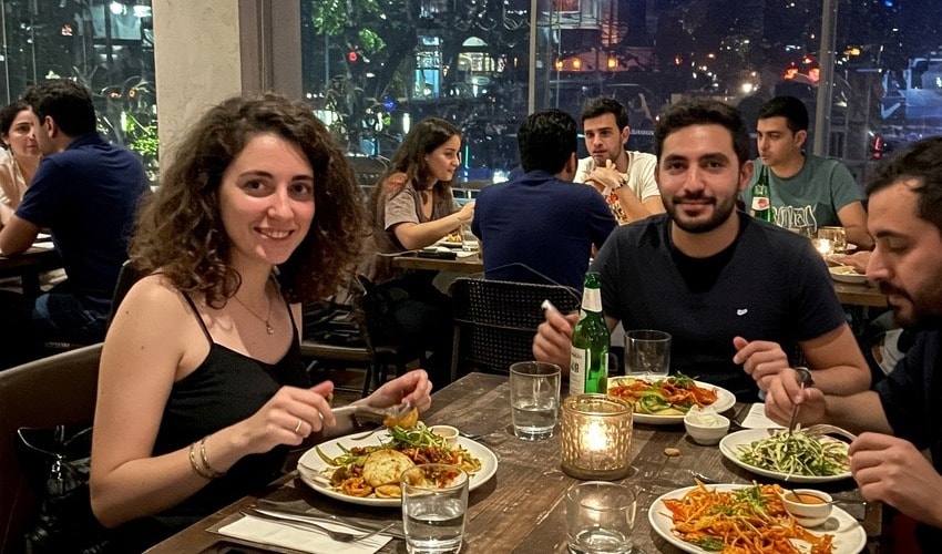 Expats enjoying Pune's cosmopolitan lifestyle at a trendy restaurant in the city.